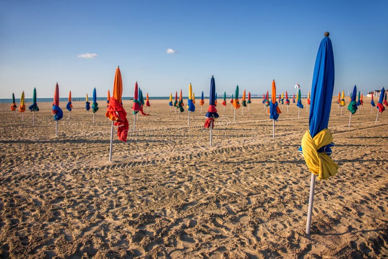 Colorful parasols on Deauville beach royalty free stock image