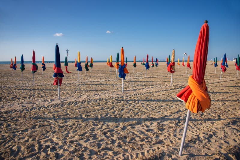 Colorful parasols on Deauville beach royalty free stock photos