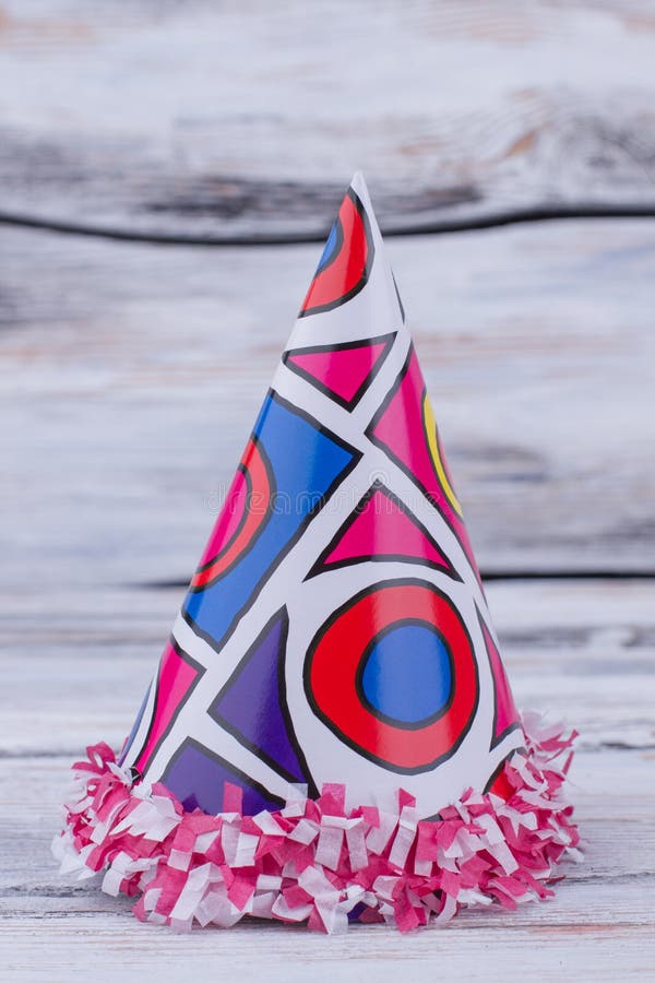 Colorful party hat on wooden background. stock photos Colorful party hat on wooden background. stock photos