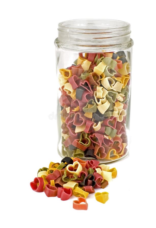 Colorful pasta hearts in a jar