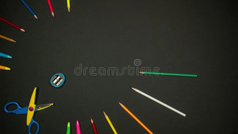 Colorful Pencils Forming Butterfly on Black Background. Back to School Background. Stop Motion