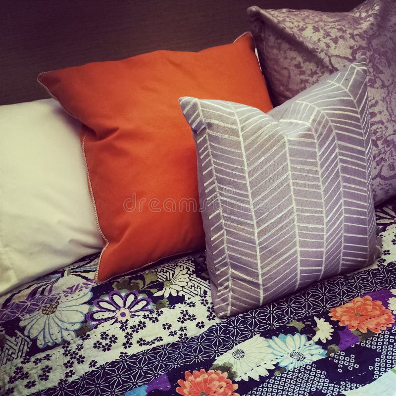 Colorful pillows on a bed stock photo. Image of sleep 41069874