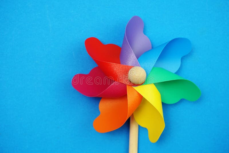 Colorful pinwheel with space copy isolated on blue background