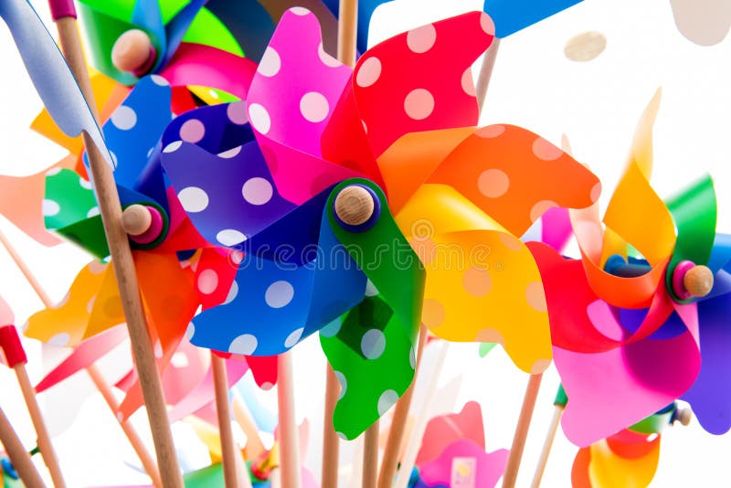 Colorful pinwheels against white background royalty free stock images