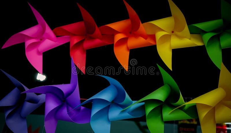 Colorful pinwheels on black background royalty free stock photo