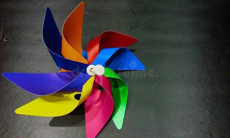 Colorful pinwheels closeup black background royalty free stock photography