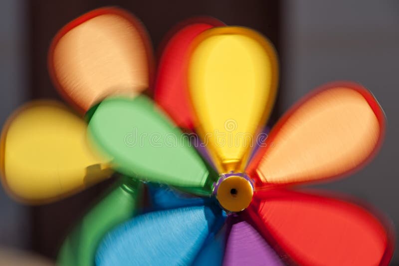 Colorful pinwheels in motion stock images
