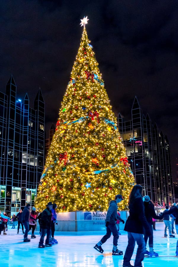 The colorful Pittsburgh Chrsitmas tree surrounded by ice skaters. The colorful Pittsburgh Chrsitmas tree surrounded by ice skaters.