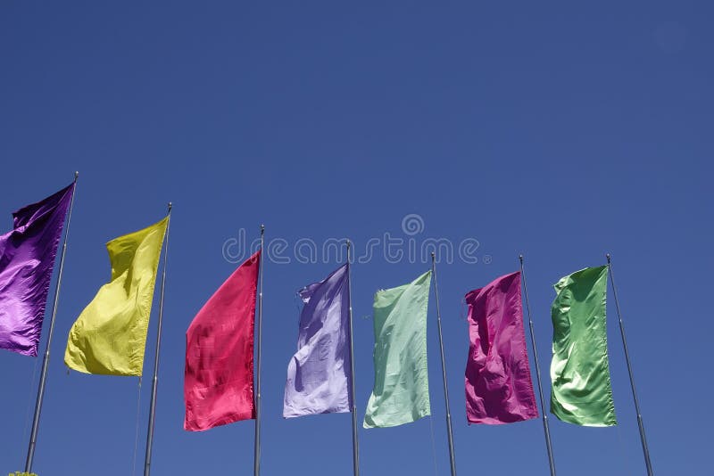 Colorful plain flag on blue sky background stock photo Colorful plain flag on blue sky background stock photo