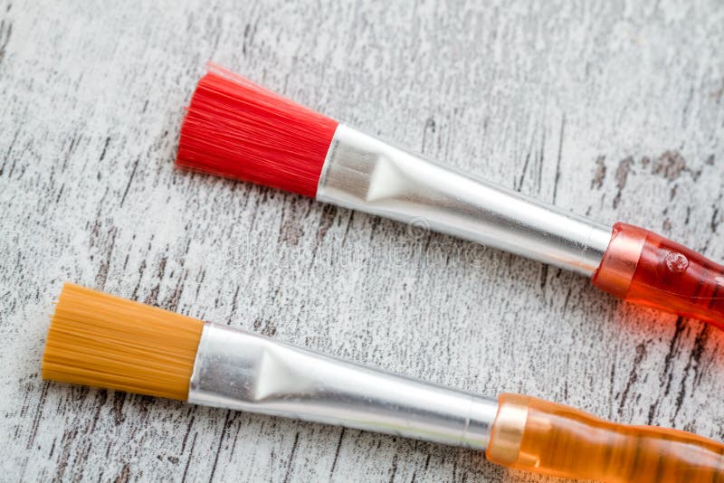 Colorful Plastic Brushes on White Wooden Background Stock Photo Image