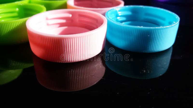 Colorful plastic lids stock image