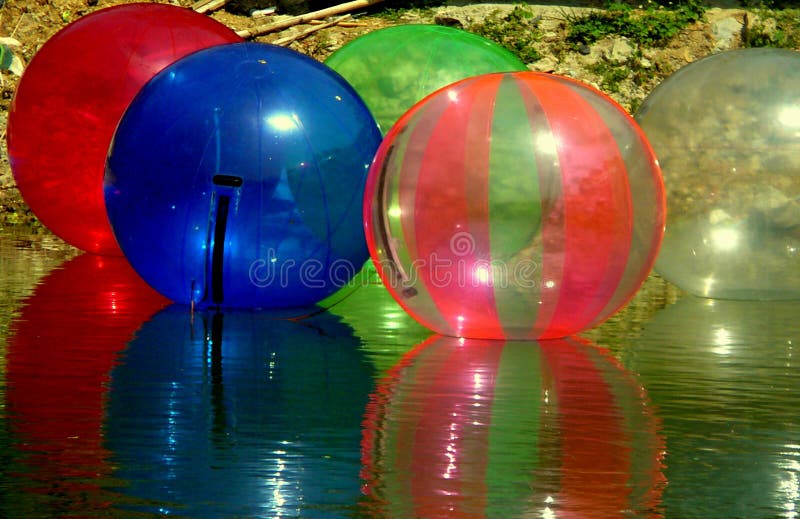 Water Red Gel Balls With Bokeh. Polymer Gel. Silica Gel. Balls Of Red
