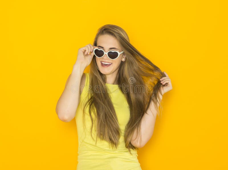 Colorful portrait of young attractive woman wearing sunglasses. Summer beauty concept