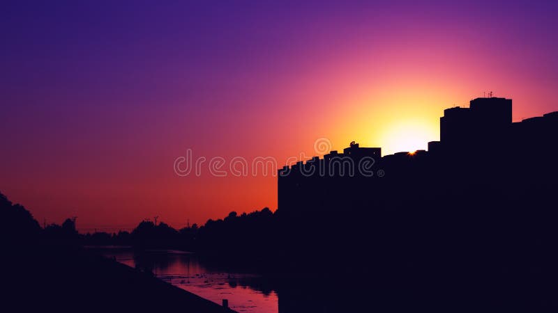 Colorful Purple Sunset and Buildings in the Dark Shade Stock Image ...