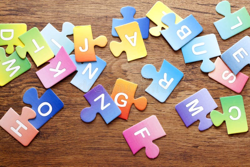 Colorful puzzle letters background royalty free stock photos