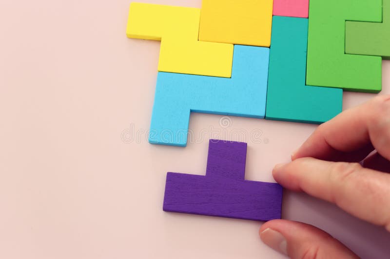 Colorful puzzle on a pastel background stock image
