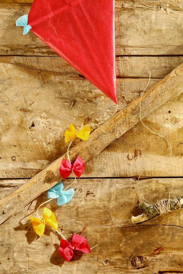 Colorful red rustic kite with bows