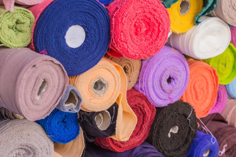 Colorful roll of cotton Fabrics sale in the market.