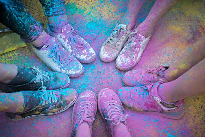 The colorful shoes and legs of teenagers at color run event royalty free stock photo The colorful shoes and legs of teenagers at color run event royalty free stock photo