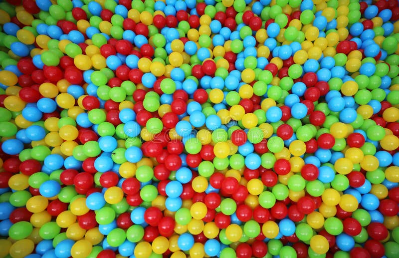 A lot of colorful small plastic balls in ball pool stock photos