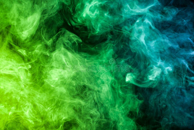 Colorful smoke of green on a black background. Background from the smoke of vape