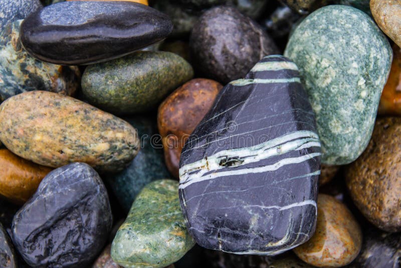 Colorful smooth rocks on the beach