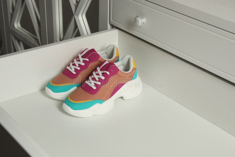 Colorful Sneakers in Drawer. Footwear Storage Stock Image Image of
