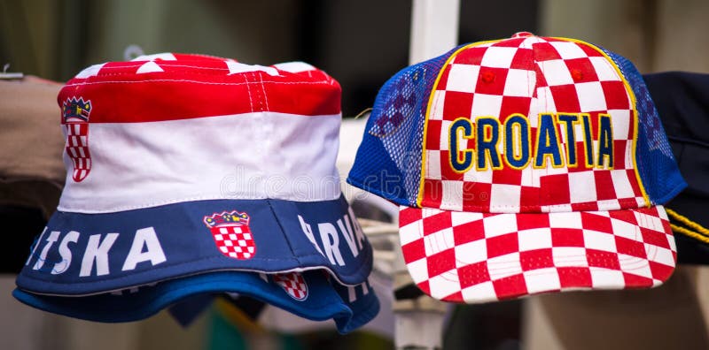 Colorful souvenir hats of Croatia on sale at the market.