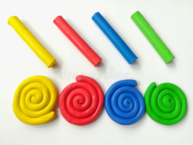 Colorful spiral plasticine, multicolored sticks clay dough, white background