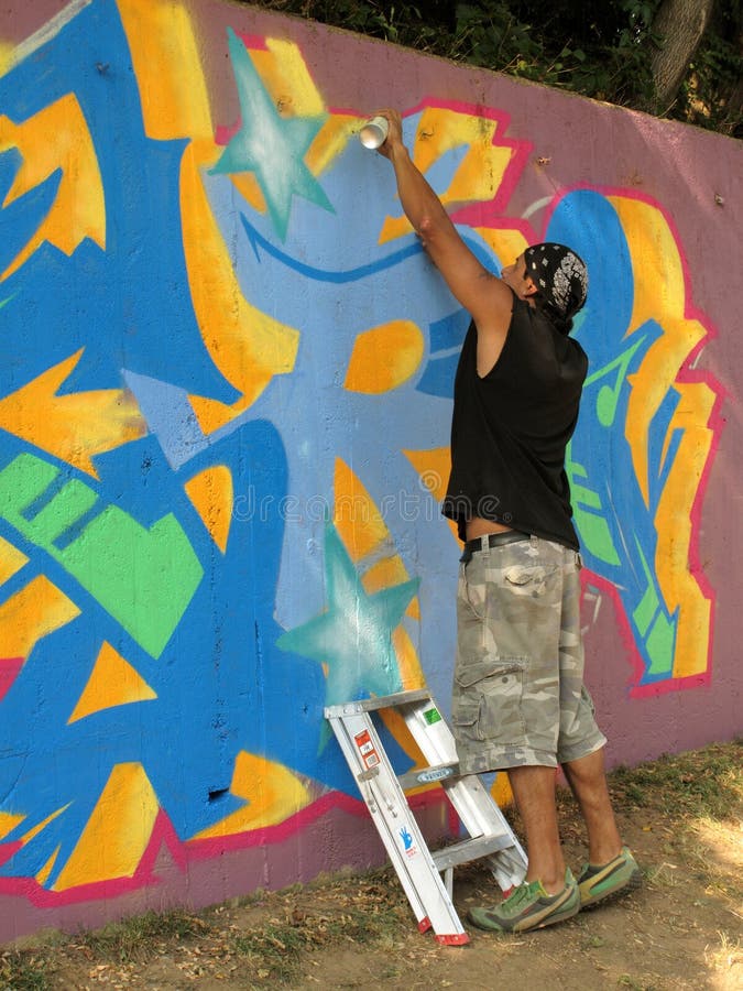 Spray Painting the Wall editorial photography. Image of center 10566632