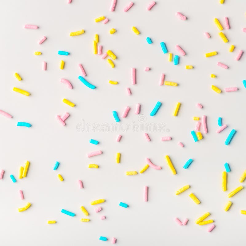 colorful sprinkles on white background