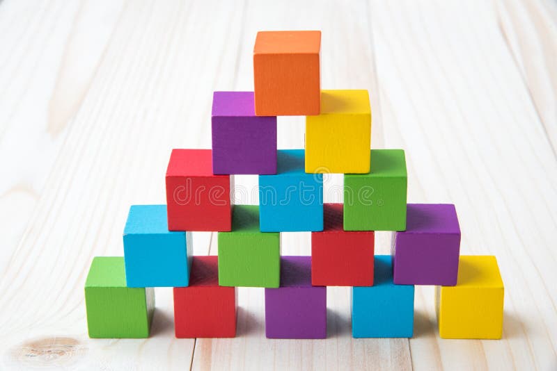 Colorful Stack of Wood Cube Building Blocks on Black Background Stock