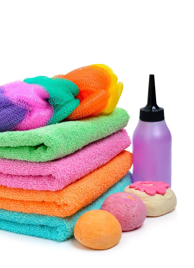 Colorful stacked spa towels, bath bombs and shampoo bottle isolated on white. Ceram stock images, royalty-free photos and pictures
