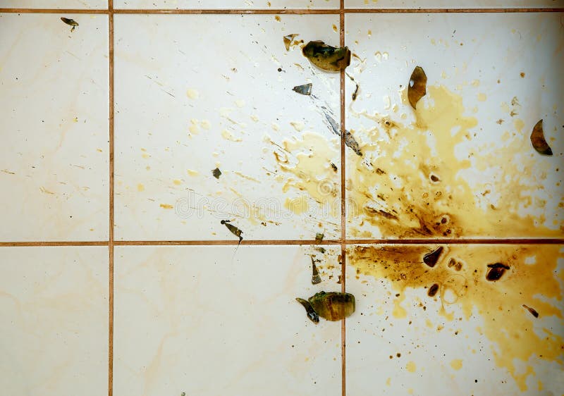 Colorful Stains and Broken Glass on White Bathroom Tiles. Stock Image