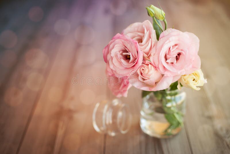 Colorful still life with roses in glass vase