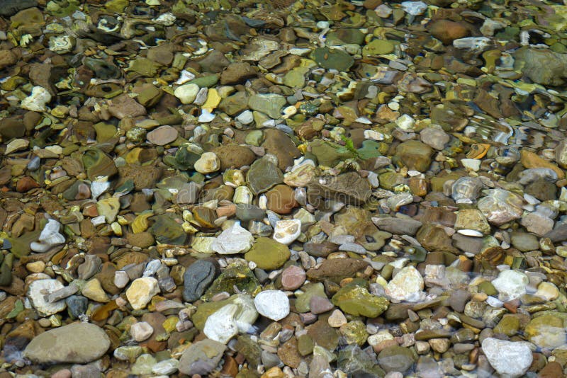 Colorful stones in the water.