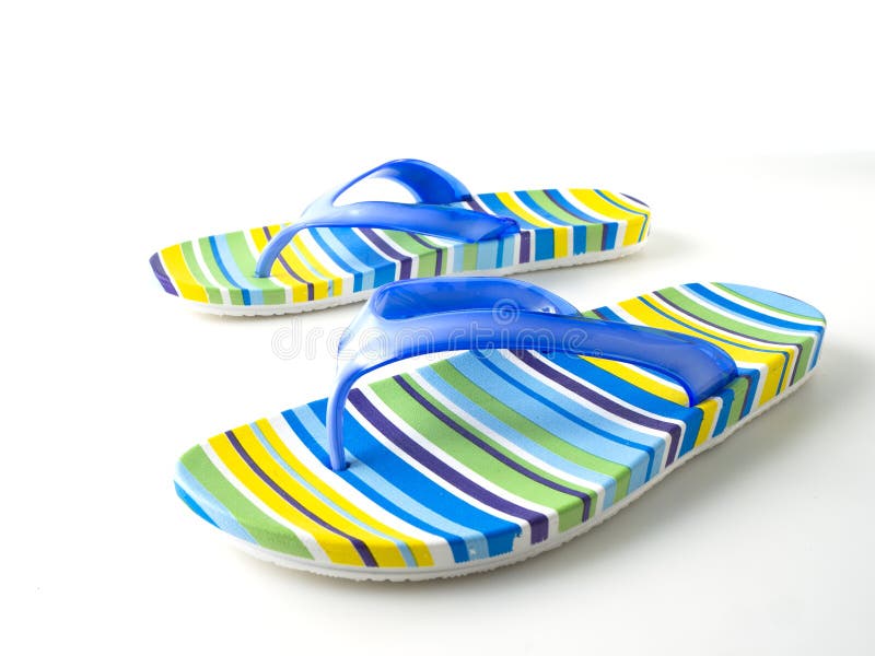 Colorful striped flip flops on white background