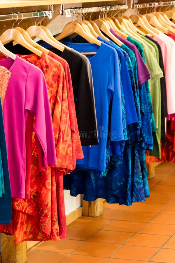 https://thumbs.dreamstime.com/b/colorful-summer-garments-clothing-store-fashion-boutique-hanging-hangers-rails-against-wall-89563668.jpg