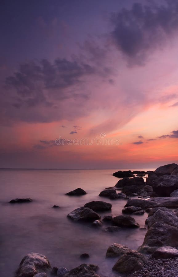 Colorful summer seascape. rocky coast at sunset