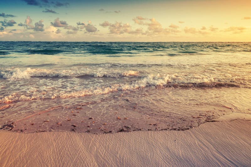 Colorful sunrise landscape on Atlantic ocean coast. Dominican republic, Punta Cana. Toned photo with filter effect