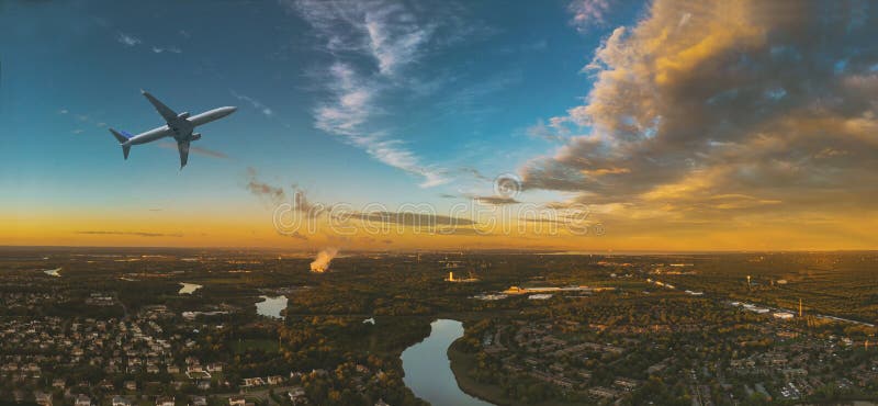 Colorful sunset airplane flying above clouds in dramatic in the clouds over the city