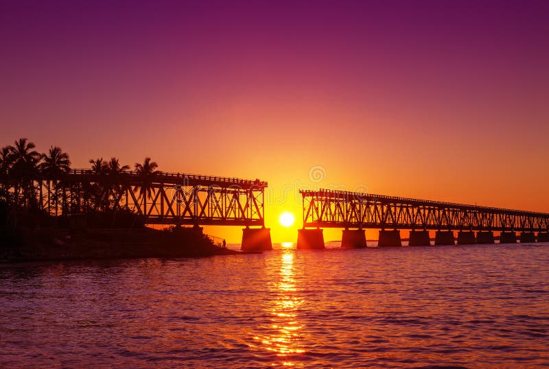 Colorful sunset at broken bridge