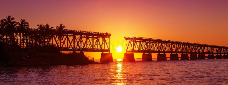 Colorful sunset at broken bridge