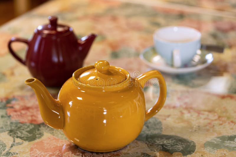 Colorful Tea Kettles on a Floral Table Cloth Stock Photo Image of container, table 175558576
