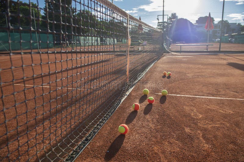 Tennis Balls on a Clay Tennis Court Stock Image Image of player Tennis Balls on a Clay Tennis Court Stock Image Image of player