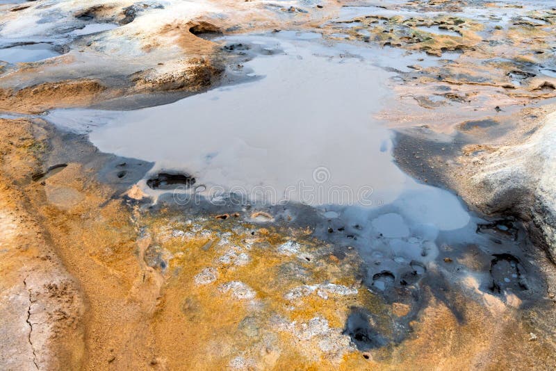 Colorful and textured volcanic ground in geothermal area in Icelandic landscape scenery. Mud and rocks with black, white and yellow color. Minerals and geology royalty free stock photos Colorful and textured volcanic ground in geothermal area in Icelandic landscape scenery. Mud and rocks with black, white and yellow color. Minerals and geology royalty free stock photos
