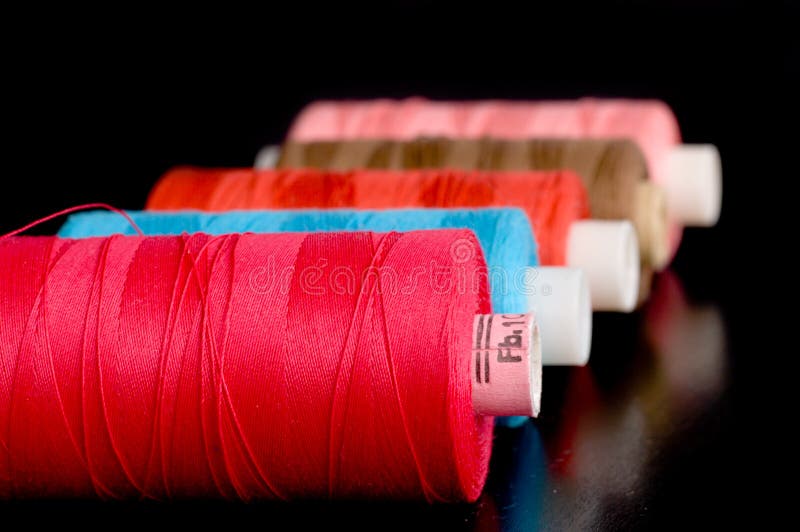 Colorful thread spools stock photo