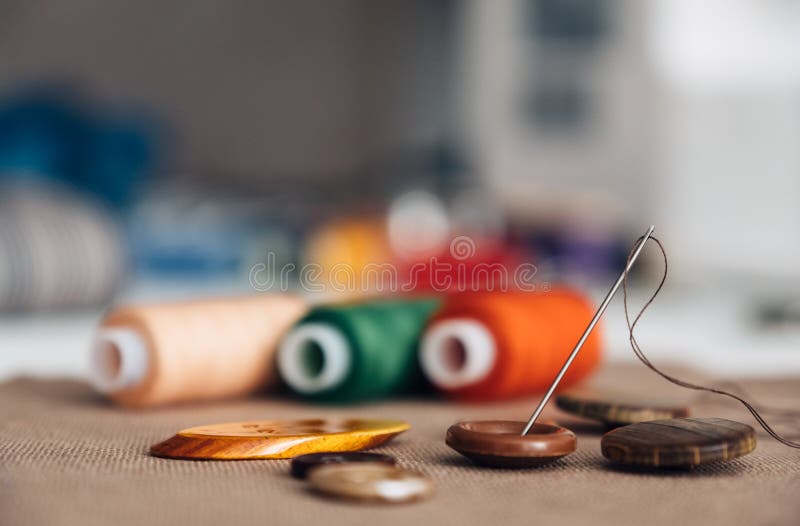 Colorful Thread Spools Used in Textile Industry and Buttons Stock Photo