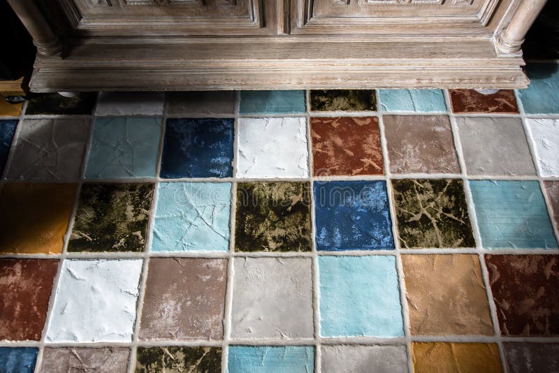 Colorful tile plunch on the floor