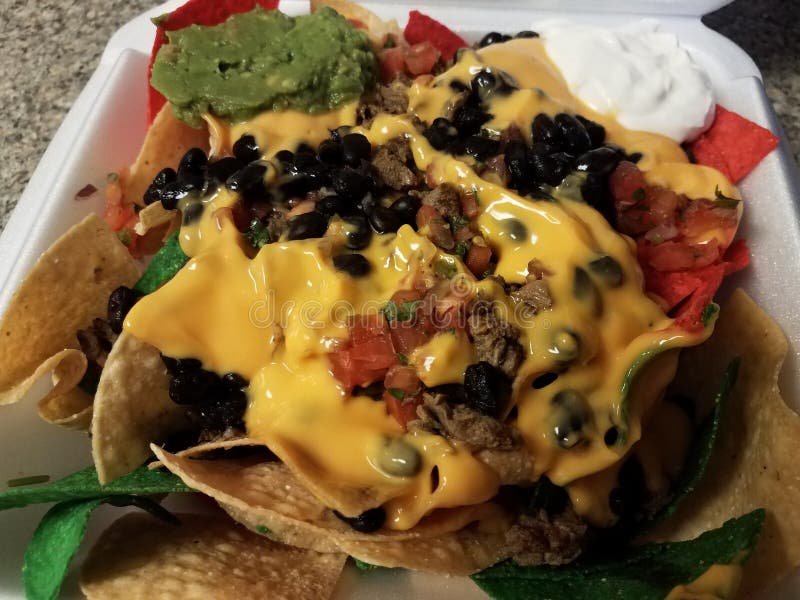 Colorful Tortilla Chips with Cheese and Beans in Box Stock Photo